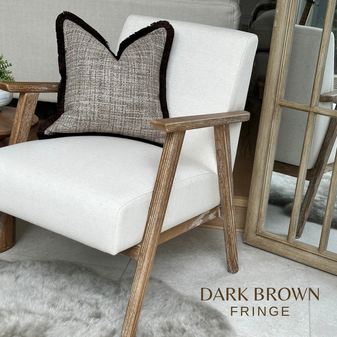 Modern organic brown textured pillow with fringe.