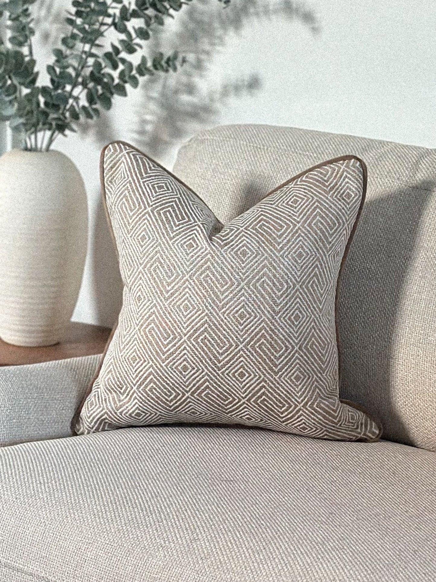 Luxury beige geometric patterned cushion