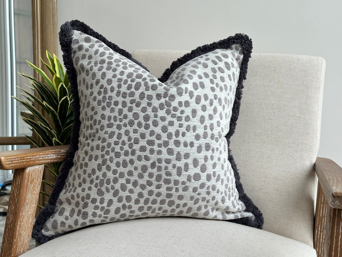 Animal print cushion with fringe