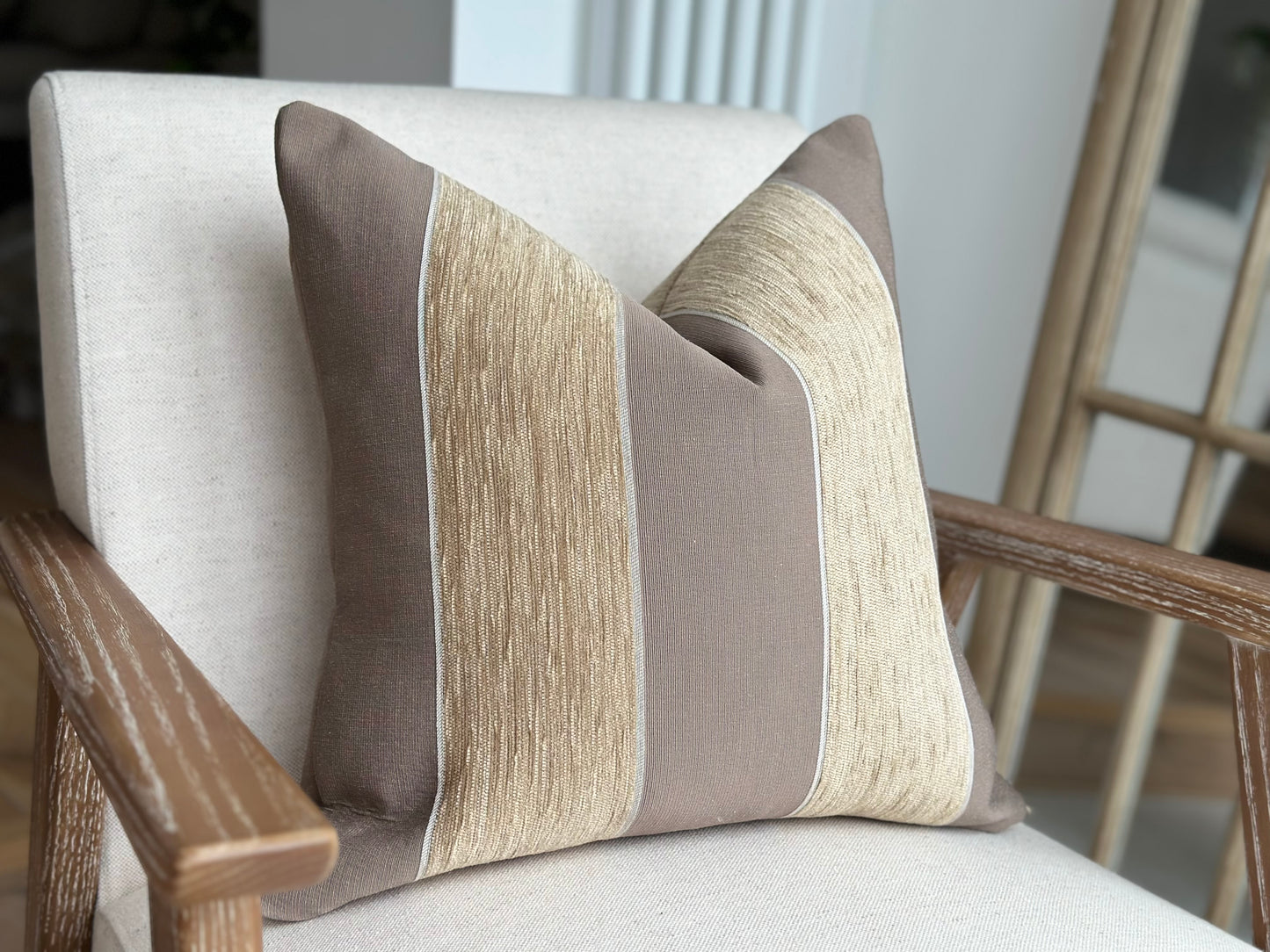 Beige cushion with stripes
