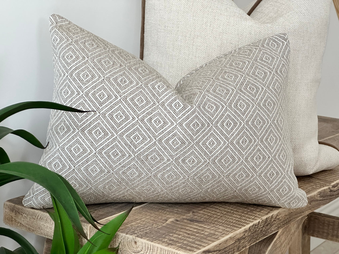 Neutral aesthetics decor. Cream beige rectangle pillow with diamond shape pattern