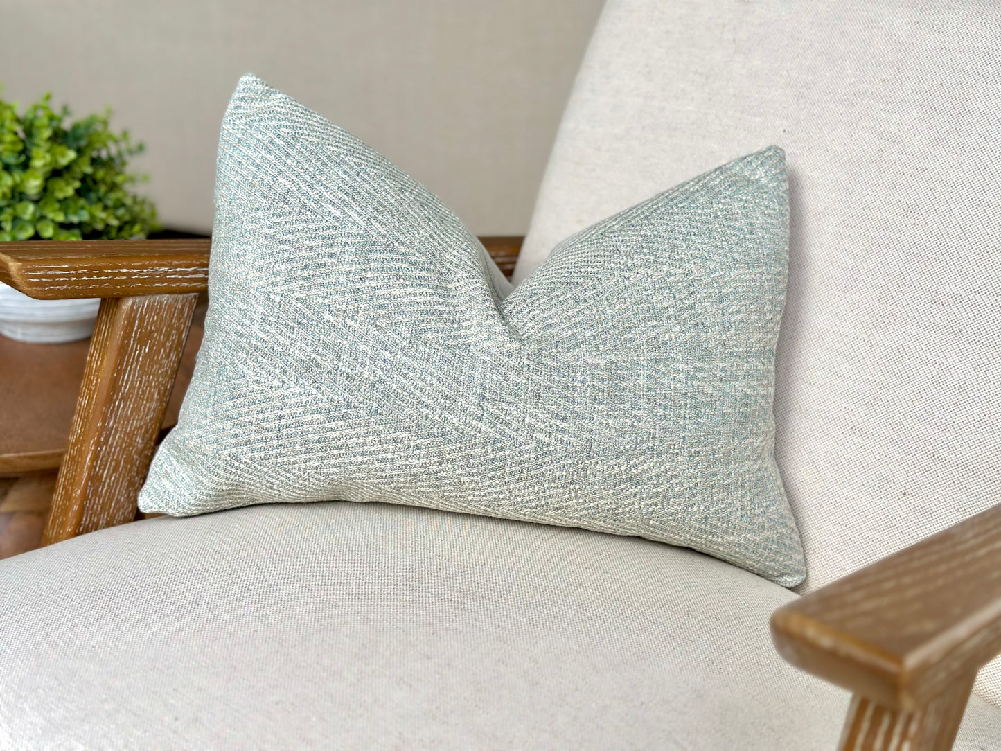 Aqua blue herringbone rectangle cushion perfect for calming costal home decor.