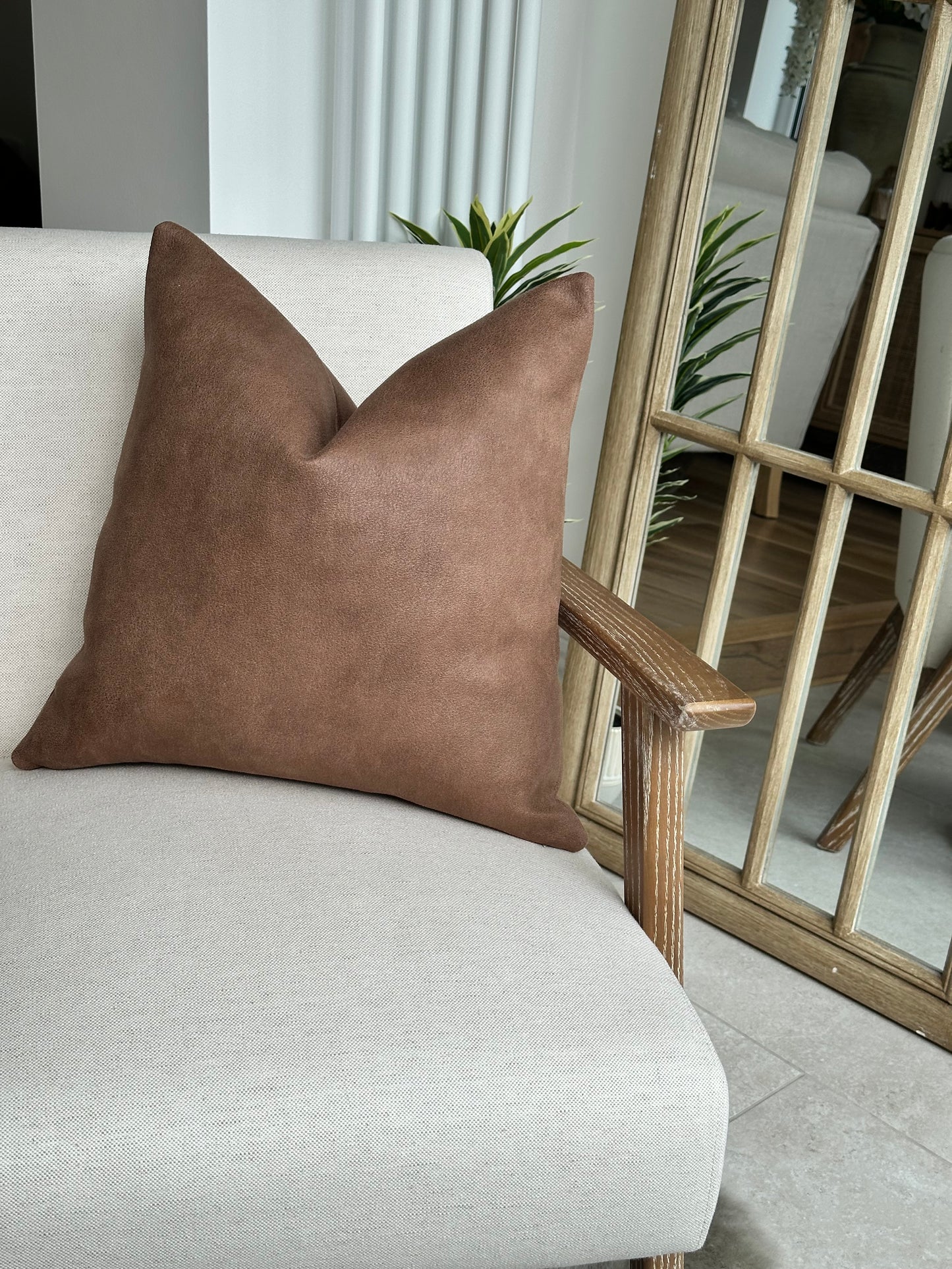 Brown tan leather look cushion, cosy rustic decor.