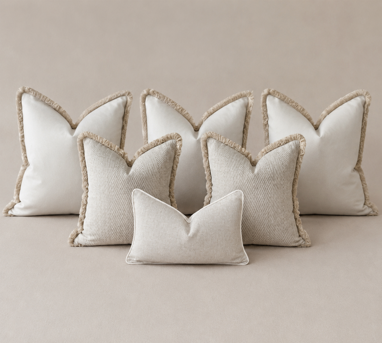 Luxury bed cushion set in ivory and neutral tones available in king and super king sizes.
