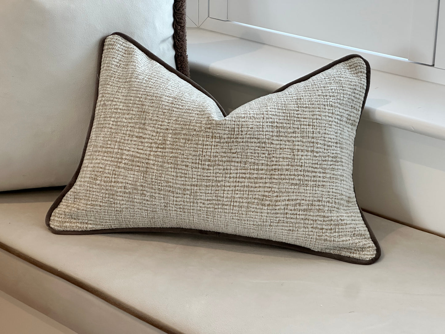 Textured cosy cream cushion perfect for neutral decor.