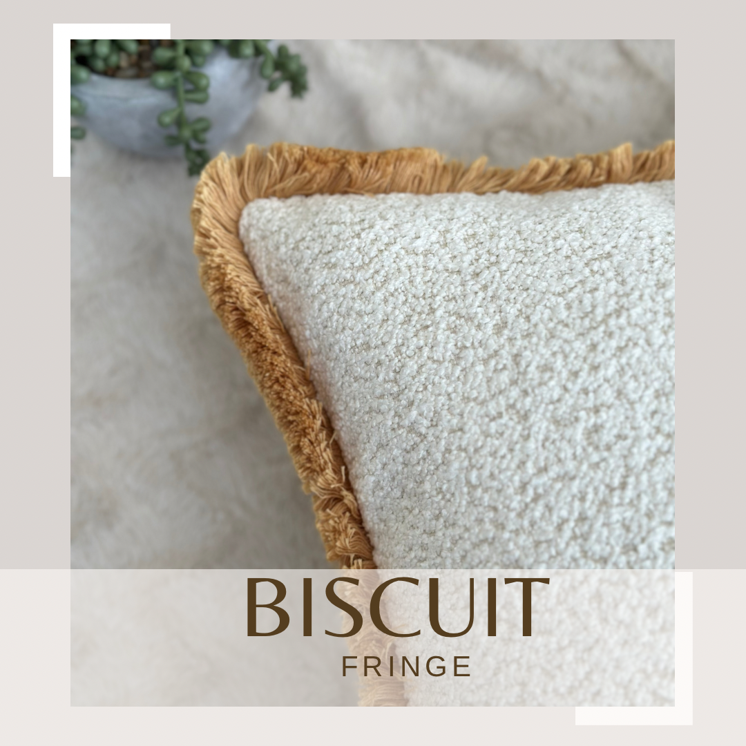 luxury ivory white boucle cushion with fringed boarder