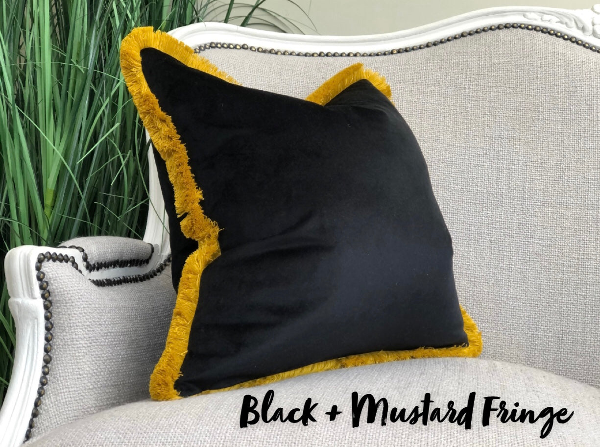 Black velvet fringed cushion