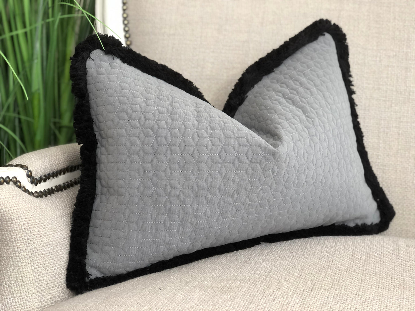 grey quilted cushion