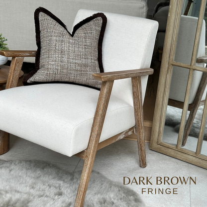 Modern organic brown textured pillow with fringe.