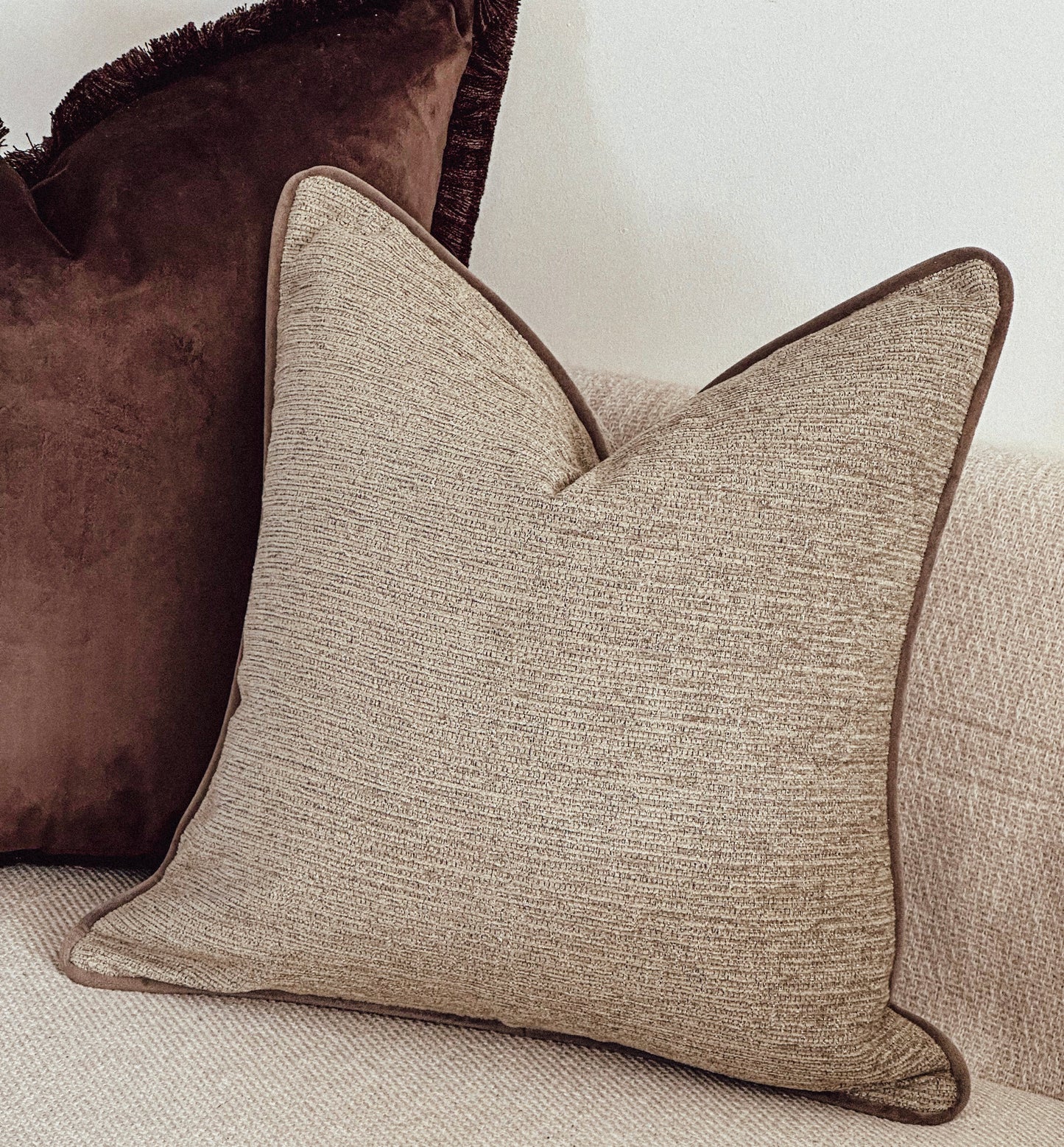 Textured beige cushion, custom made with various piping colours and sizes.