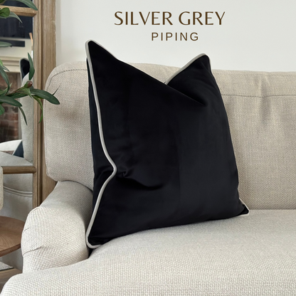 Black velvet cushion with piping
