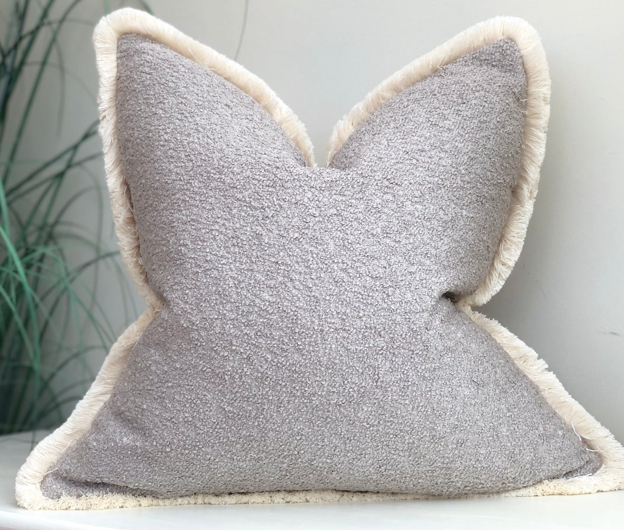 Grey boucle cushion with fringe