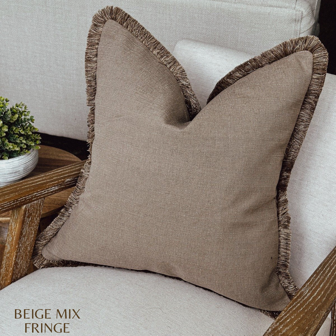 Warm brown autumnal throw pillow cover with fringe trim.