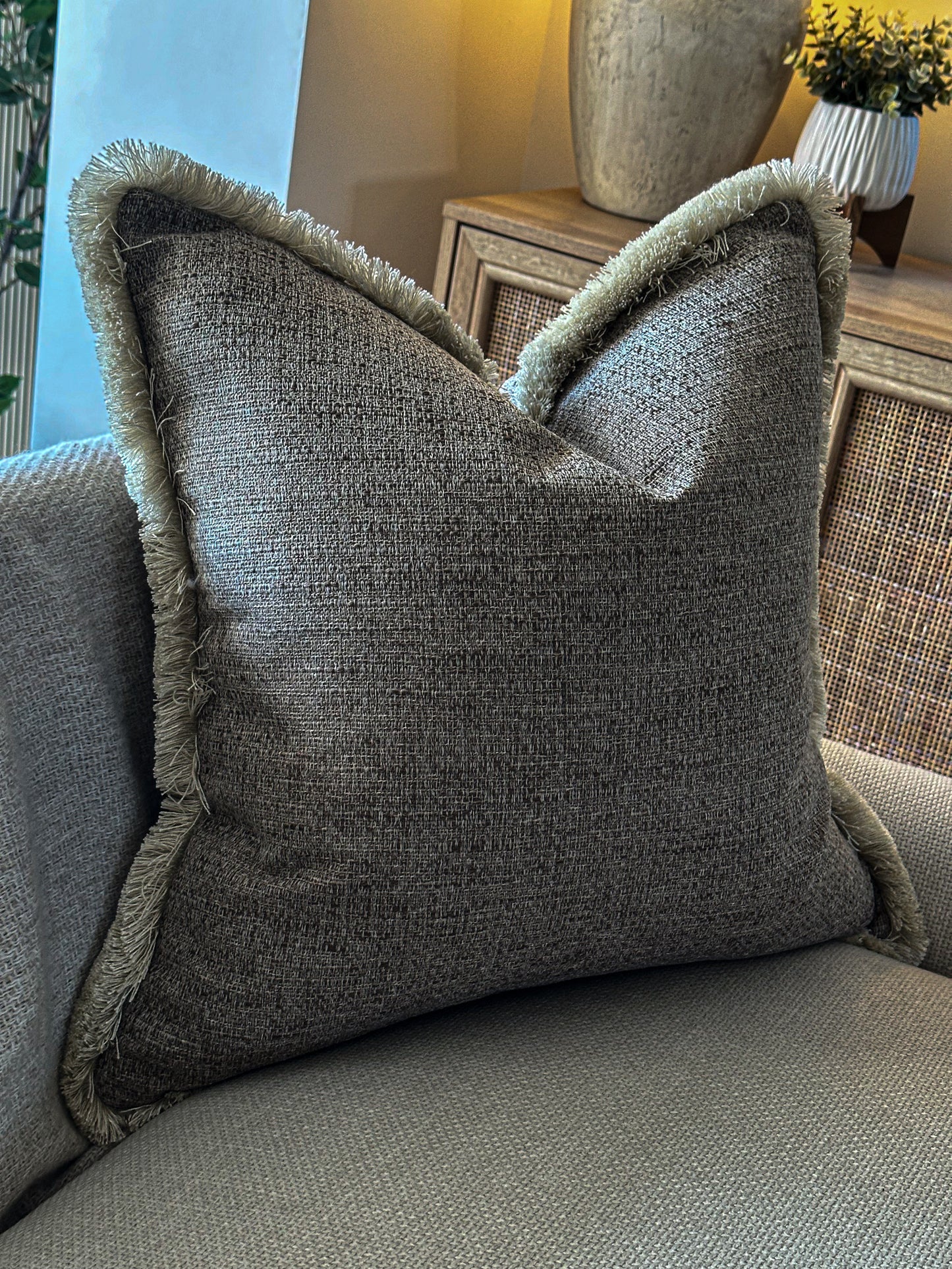 Textured brown pillow on a sofa 