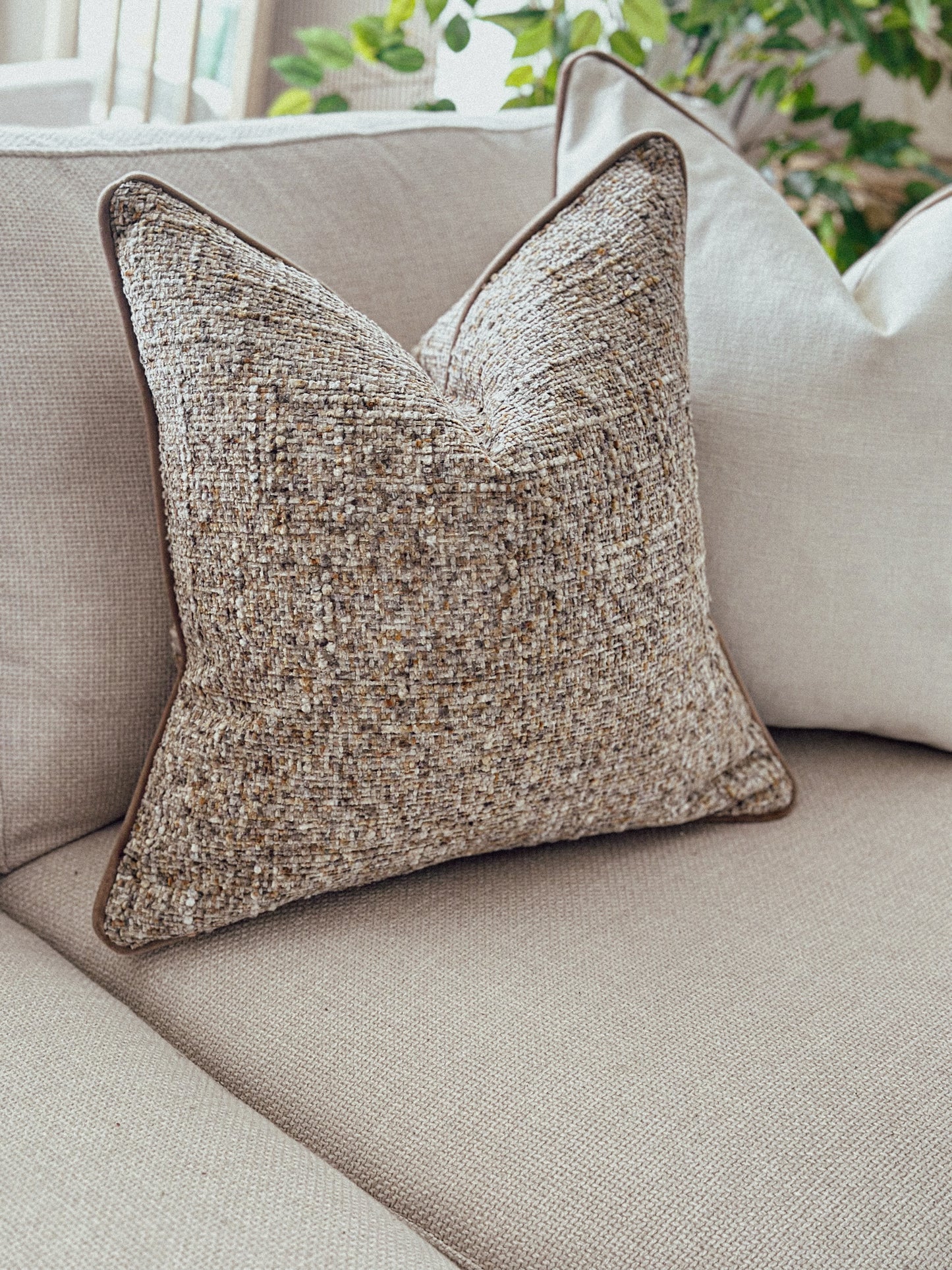 Chunky textured scatter cushion in warm caramel hues — perfect for creating a layered, inviting look.
