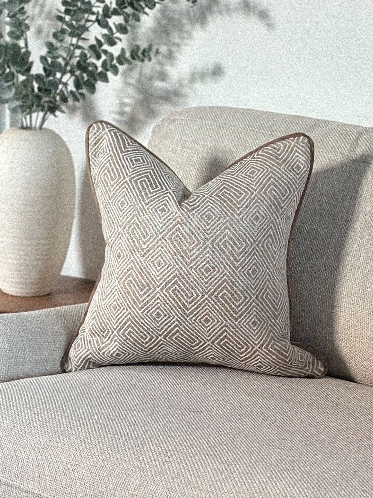 Luxury beige geometric patterned cushion