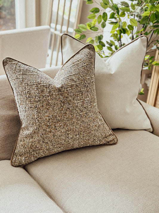 Warm caramel and taupe textured cushion with brown piping — perfect for cosy autumn d
