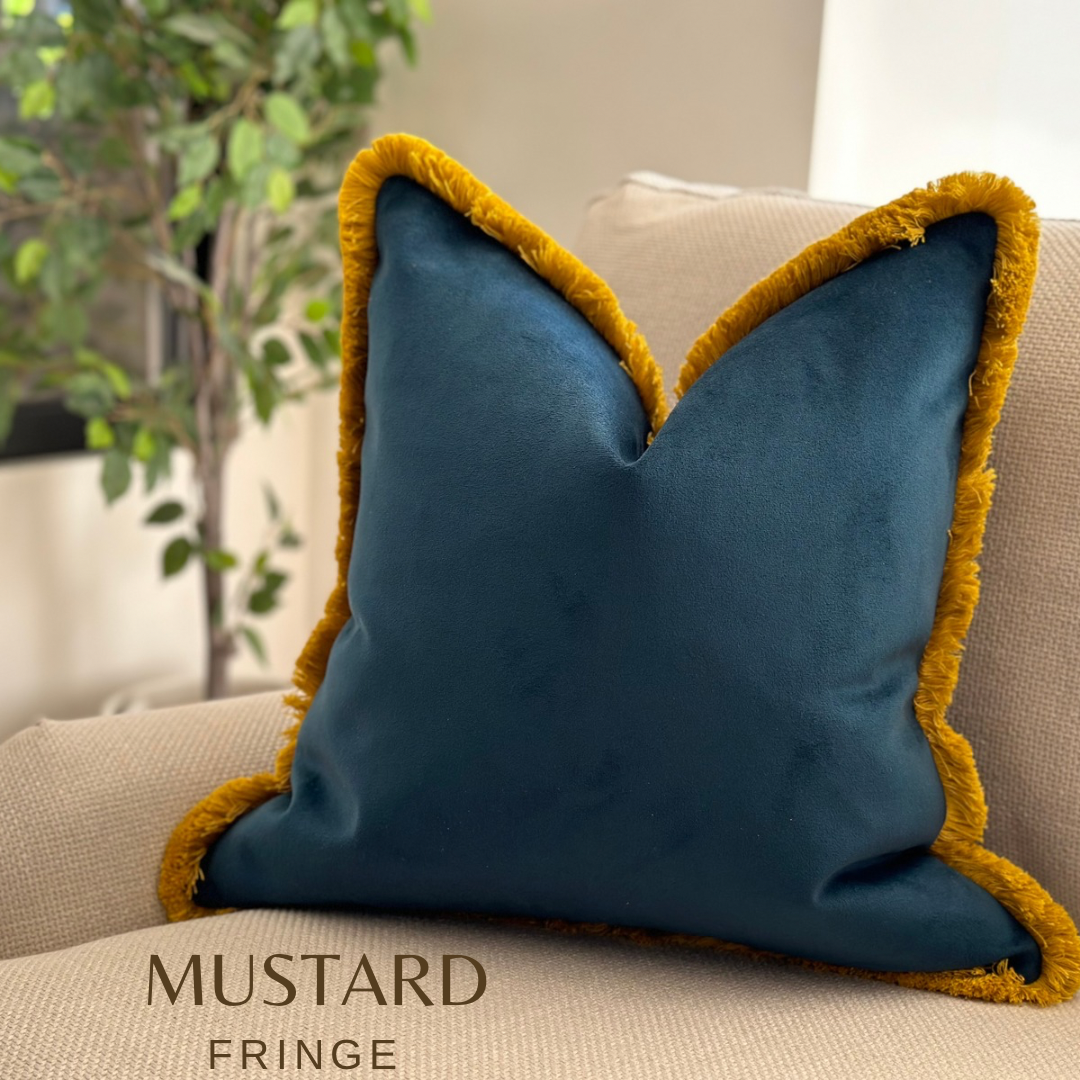 Navy blue velvet cushion with mustard fringe