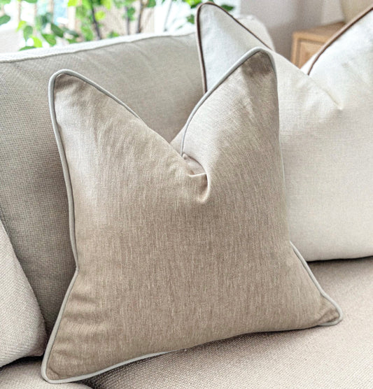 Classic beige scatter cushion with subtle contrast trim — perfect for earthy, understated interiors.