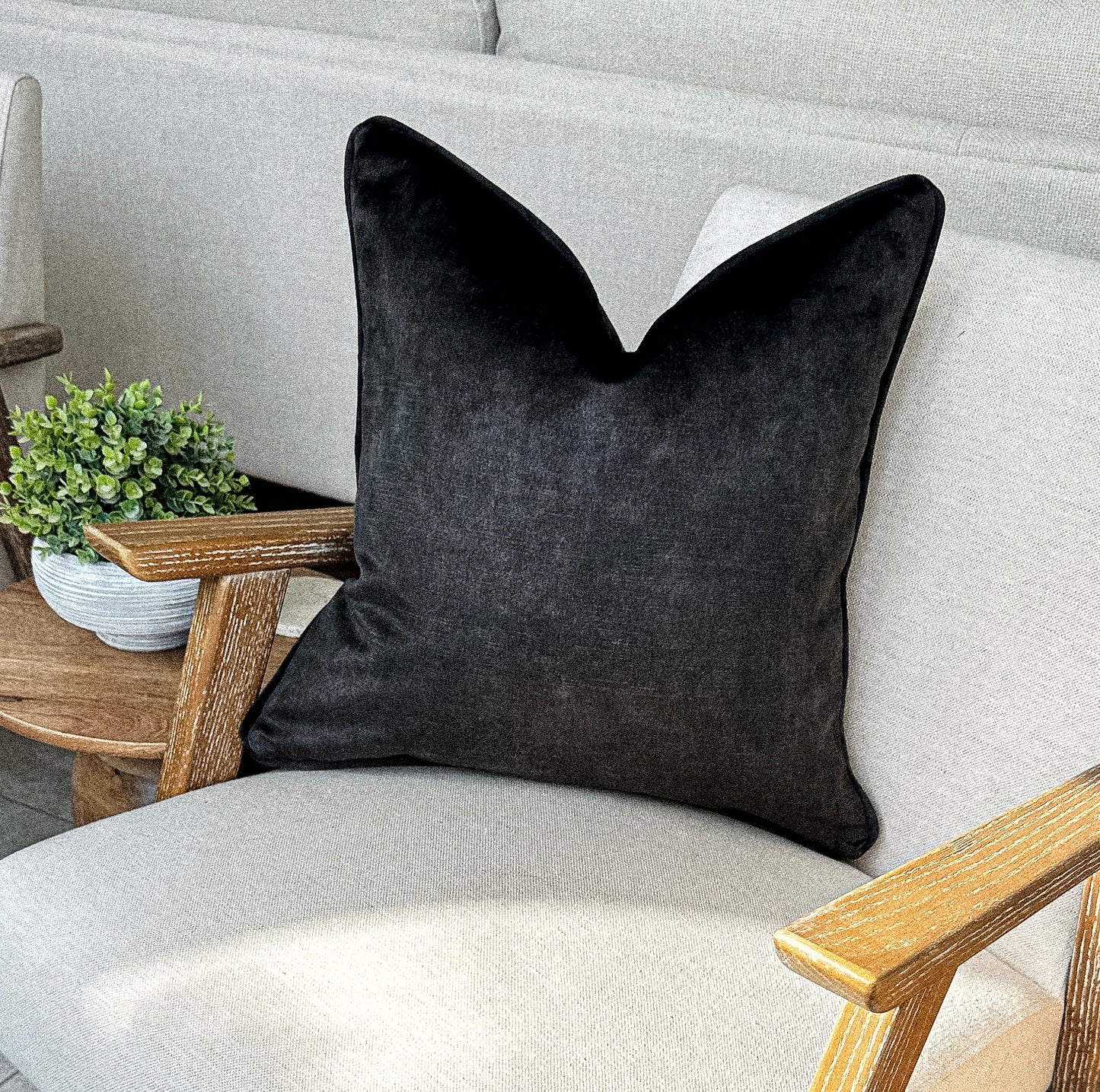 Luxury charcoal black toned velvet cushion.