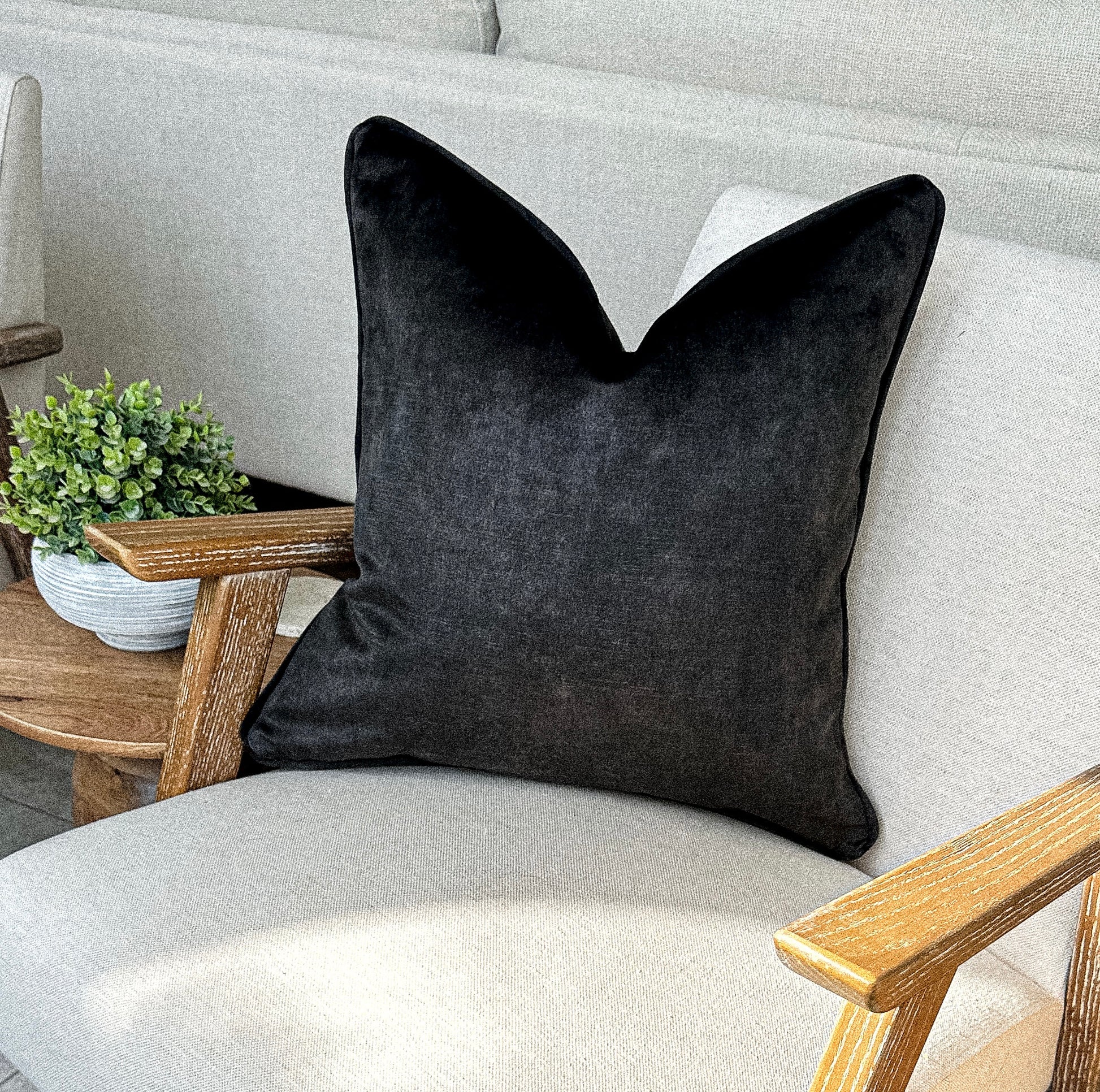 Luxury charcoal black toned velvet cushion.