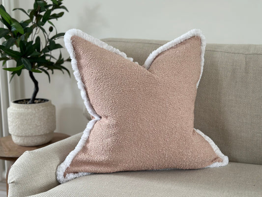 Light blush boucle cushion