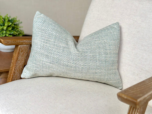 Aqua blue herringbone rectangle cushion perfect for calming costal home decor.