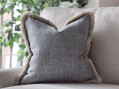 Blue geometric cushion with fringing