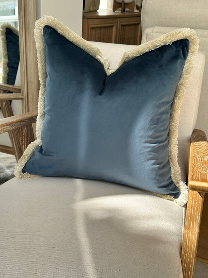 Velvet fringed scatter cushion in petrol blue.