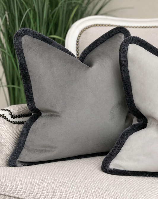 Dark grey velvet cushion with bespoke fringe trim