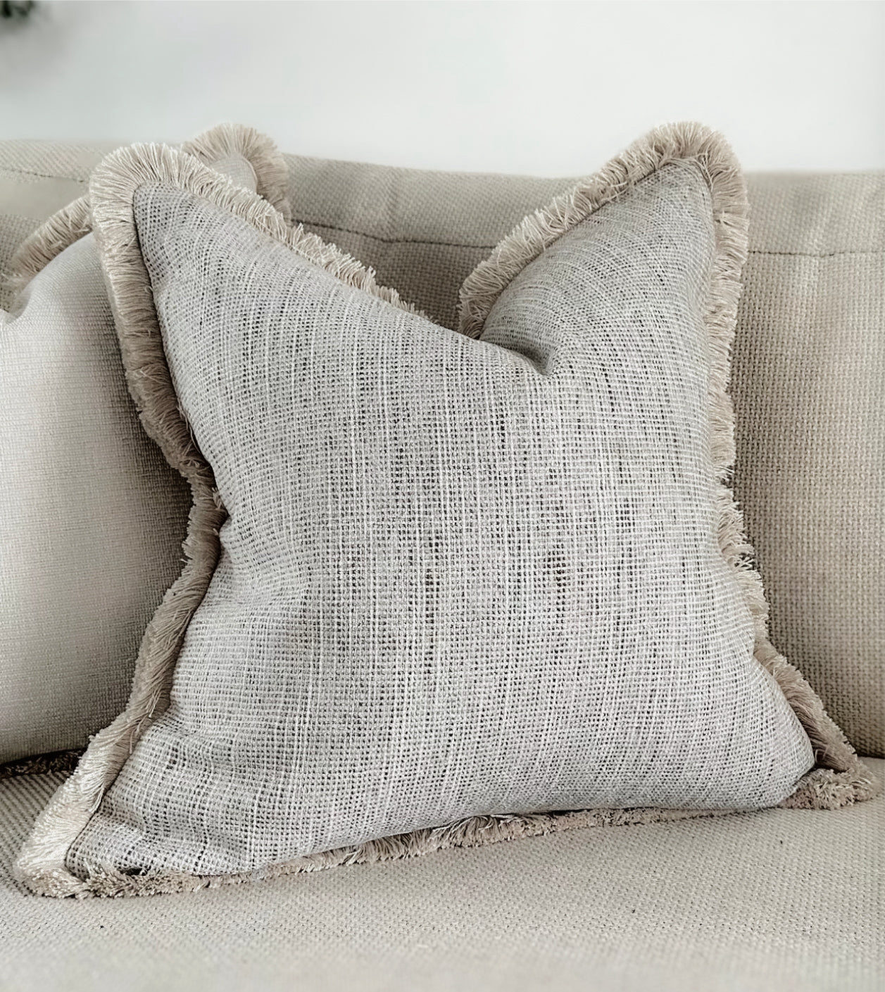 Luxury textured neutral cushion cover with fringe. Custom made bespoke cushions by the cosy cushion shop.