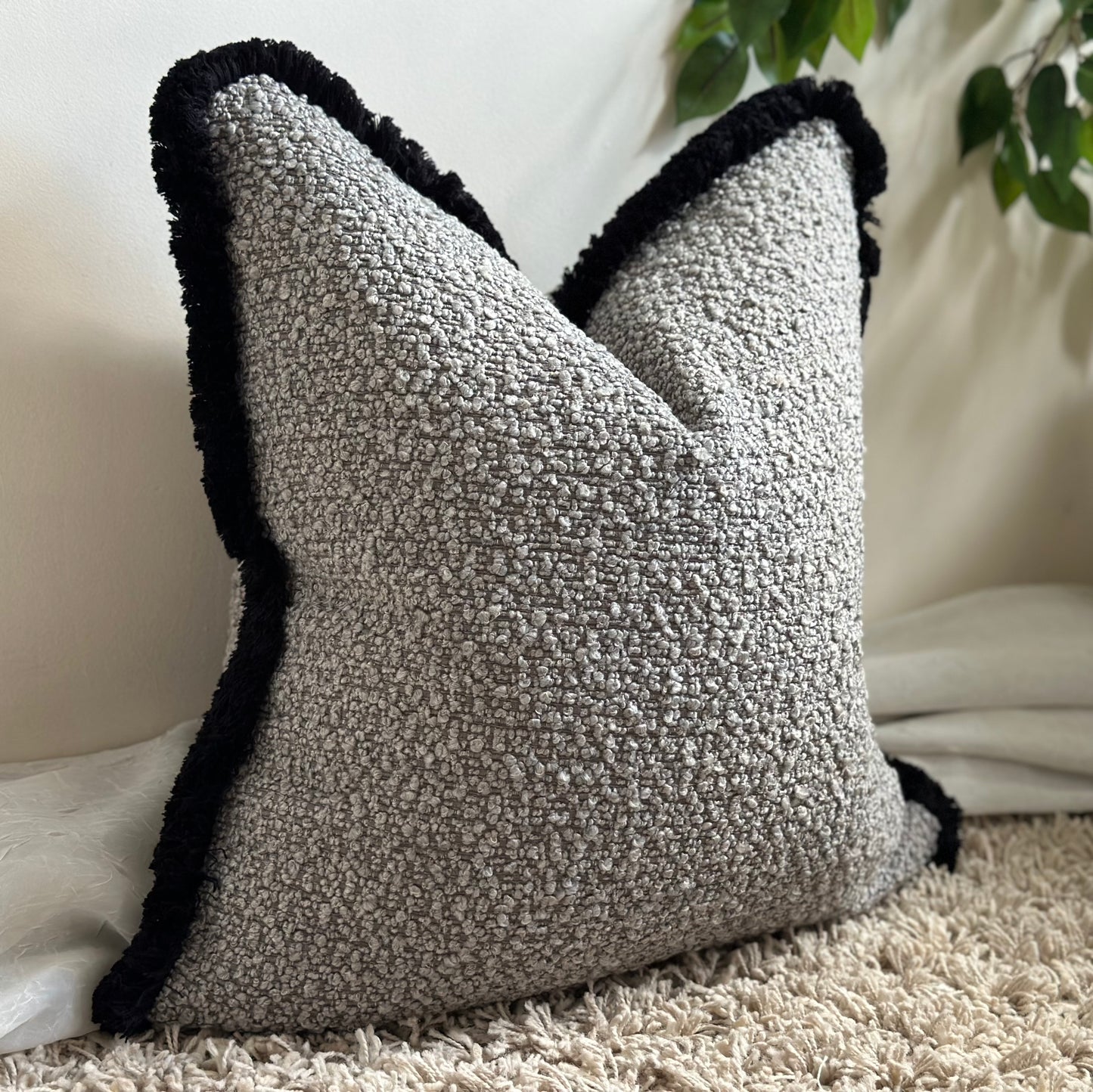 Modern home decor, grey textured boucle with black fringed trim