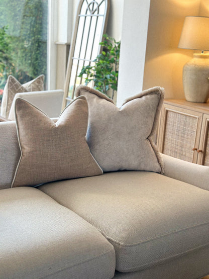 Luxury neutral decorative pillows in a living room setting