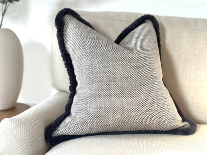 Grey textured grey fringe cushion