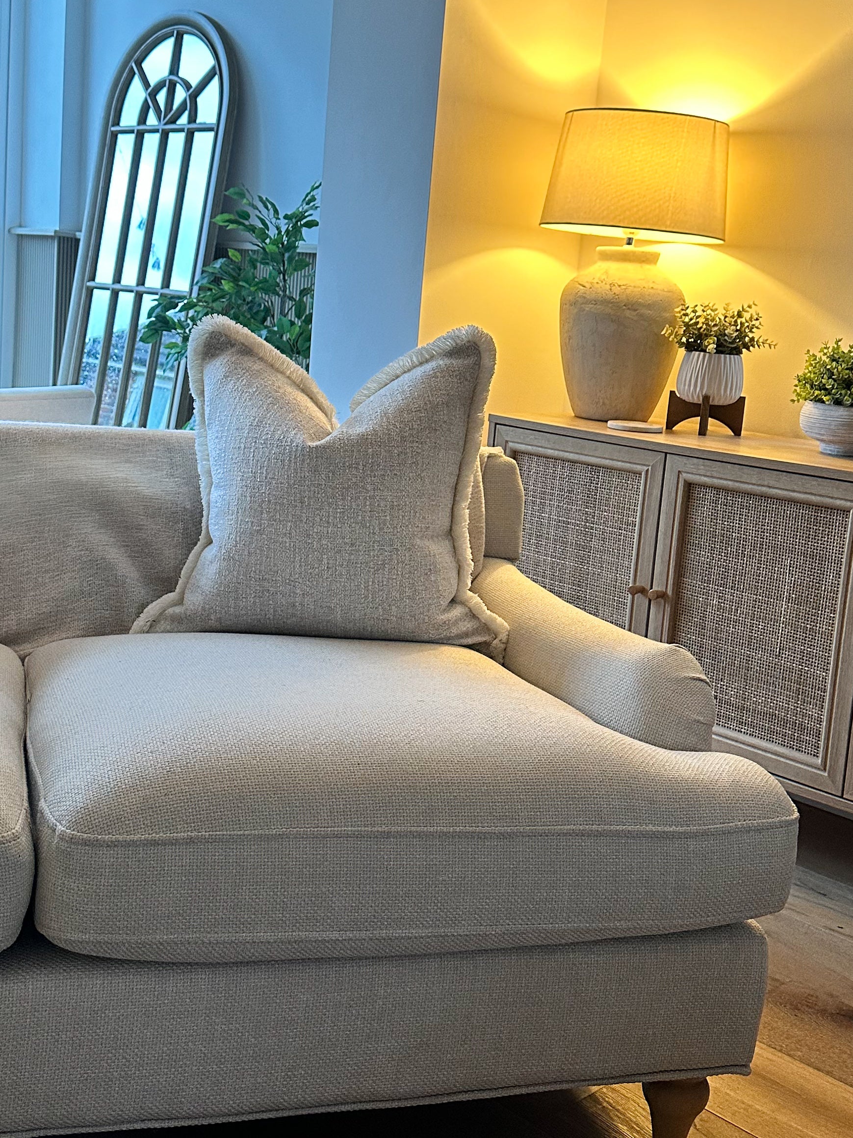 Creamy almond-toned pillow cover with tactile fabric and subtle fringe detail — ideal for calm, earthy interiors.