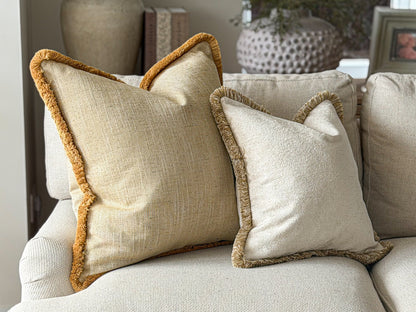 Textured summer yellow cushion with fringe trim