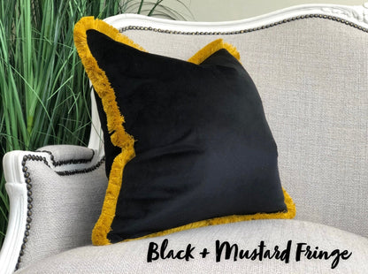 Black velvet fringed cushion